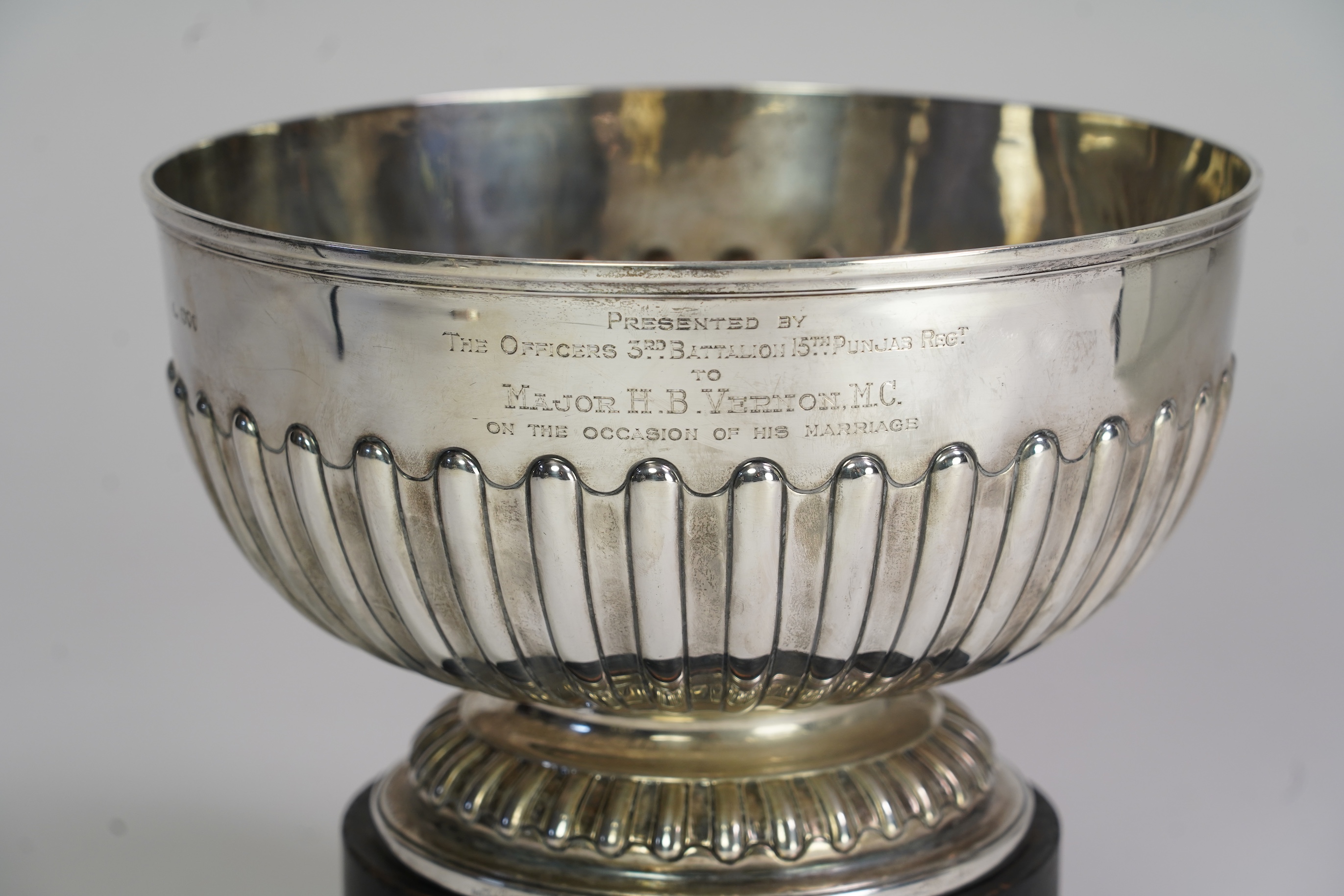 A late Victorian demi-fluted silver presentation punch bowl, by Sibray, Hall & Co